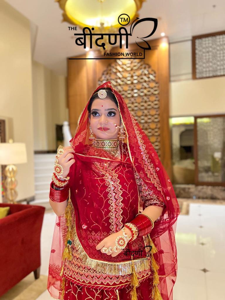 Royal Crimson: The Silk Satin Red Poshak Adorned with Golden Sequins(semi stich)