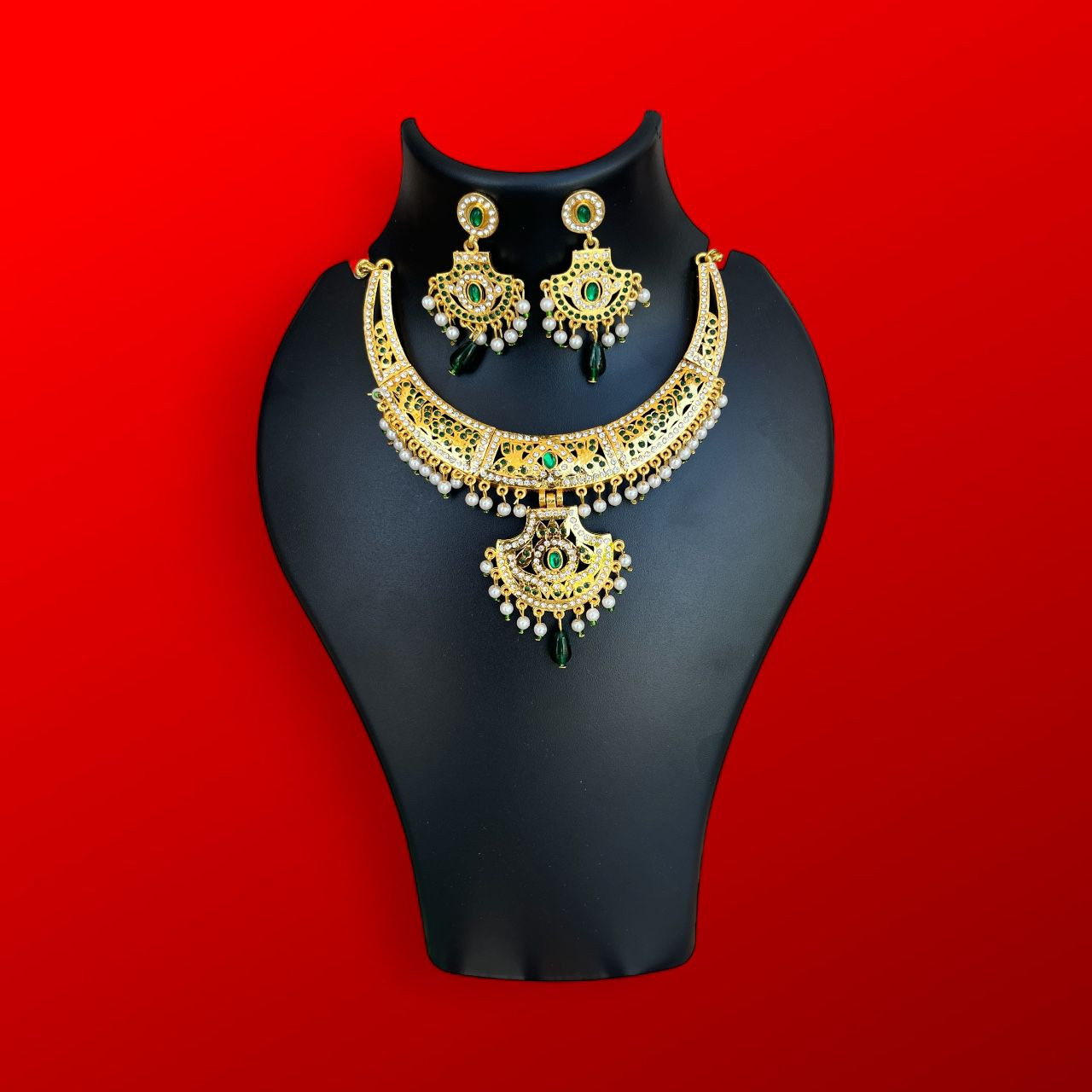 Gold Look Kundan style necklace set with green stones and pearls