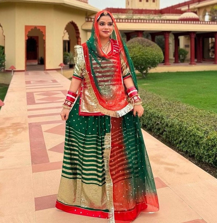 Bindani Emerald Elegance: Satin Green Poshak with Sequence Work(Semi stich)
