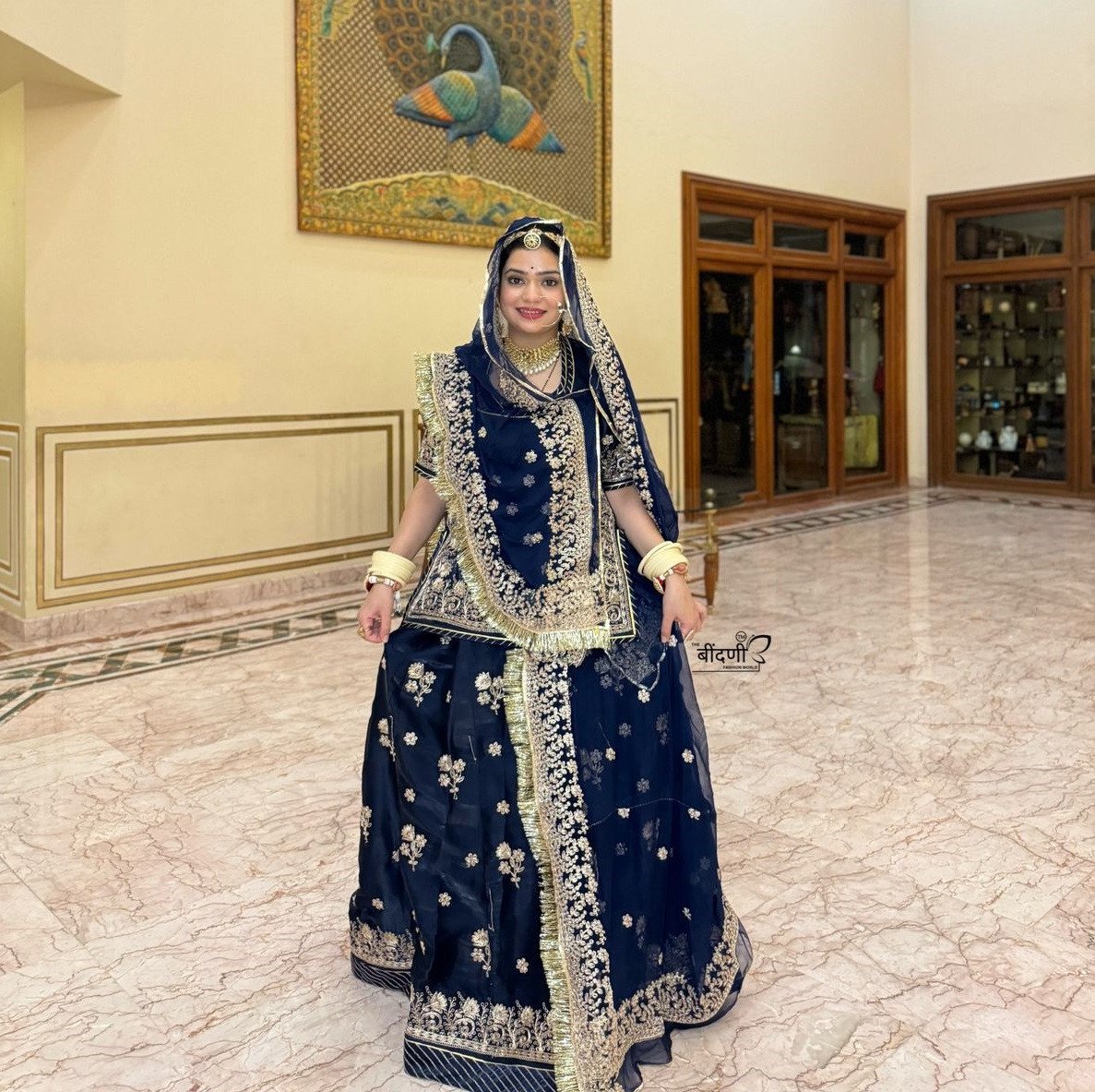 Bindani Ethereal Beauty: Blue Tissue Poshak with Intricate Jari Design(Semi stich)